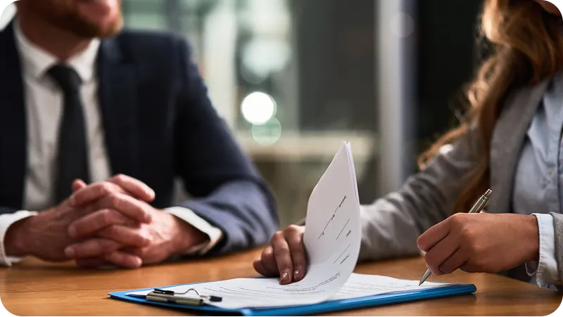 An attorney and client having discussion with regards on the agreement.