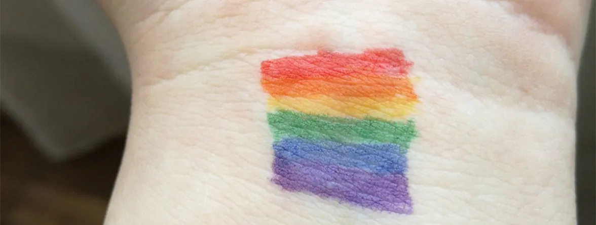 An image of colorful stripes on a hand