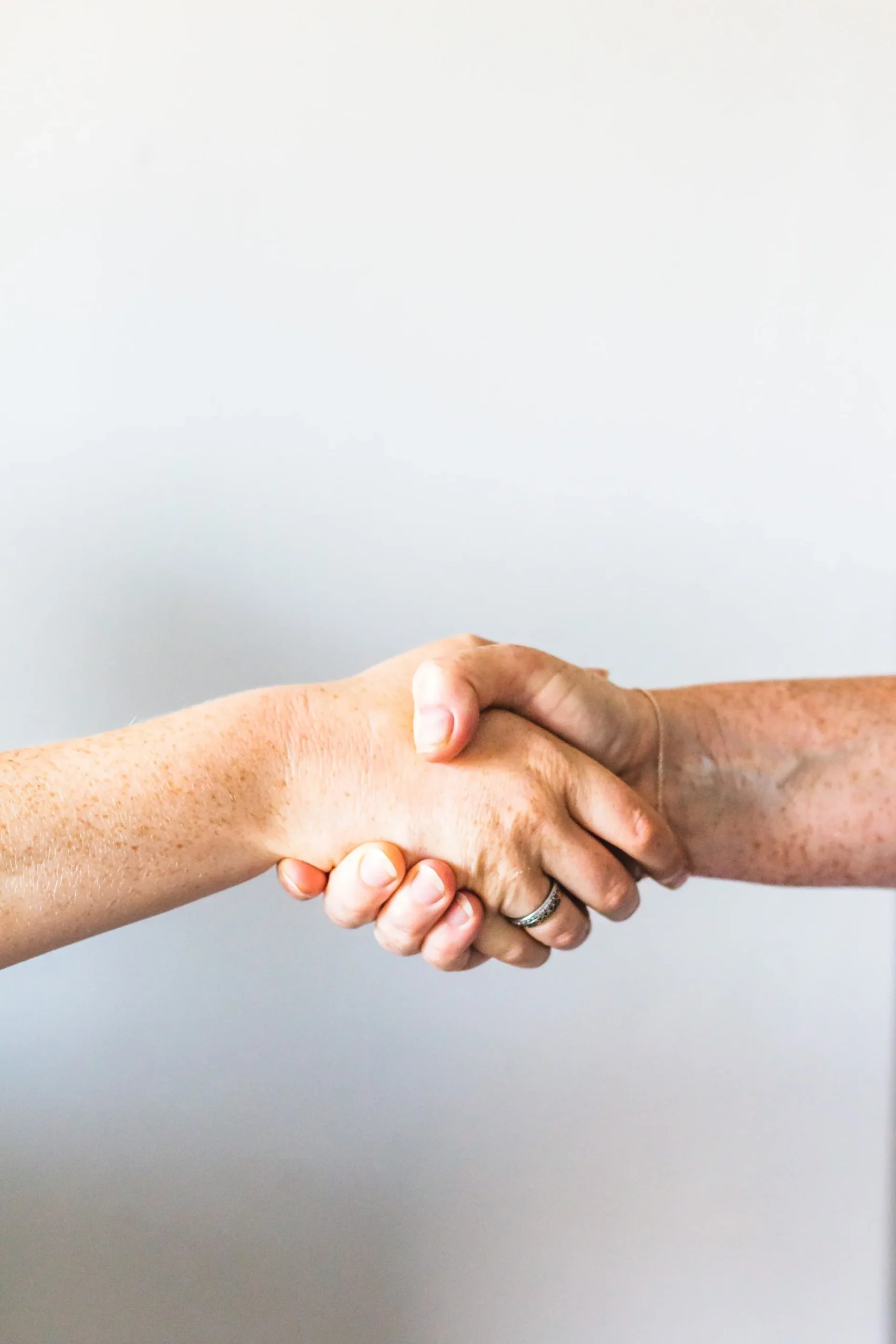 Two people shaking hands.